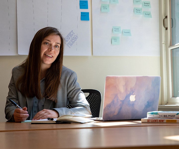 What You Can do with a Degree in Classics: Photo of student writing in notebook