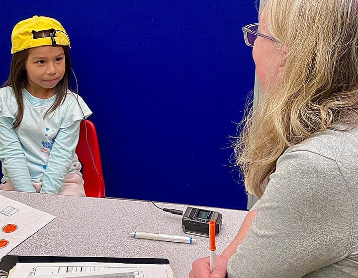 Counselor sitting with child