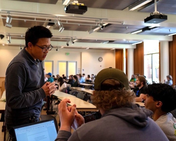 Ximing Lu, Classics professor, with students