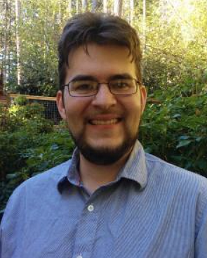 A Man with glasses smiling