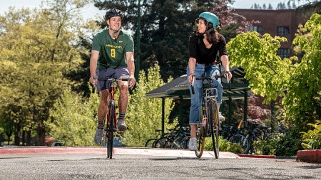 Students bike on campus