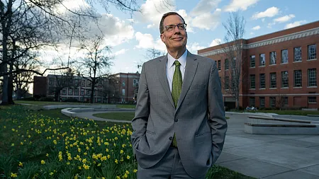 Karl Scholz poses outside on the UO campus