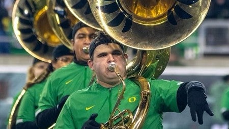 a person playing a tuba with the Oregon marching band