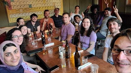 a group of people posing together at a restaurant