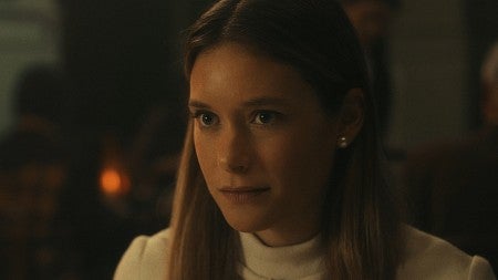 close up of blond woman looking off camera