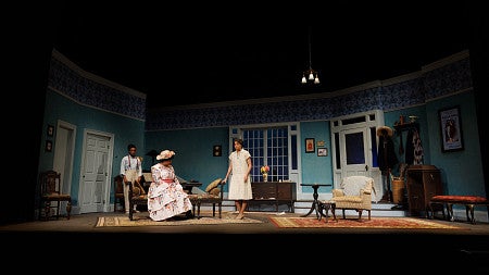 wide angle shot of three people on a stage