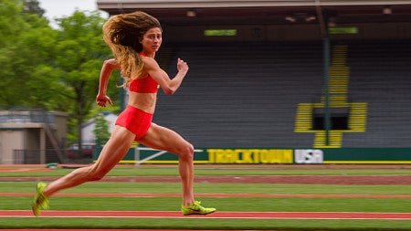 alexi pappas as plumb marigold running on the track in her movie tracktown