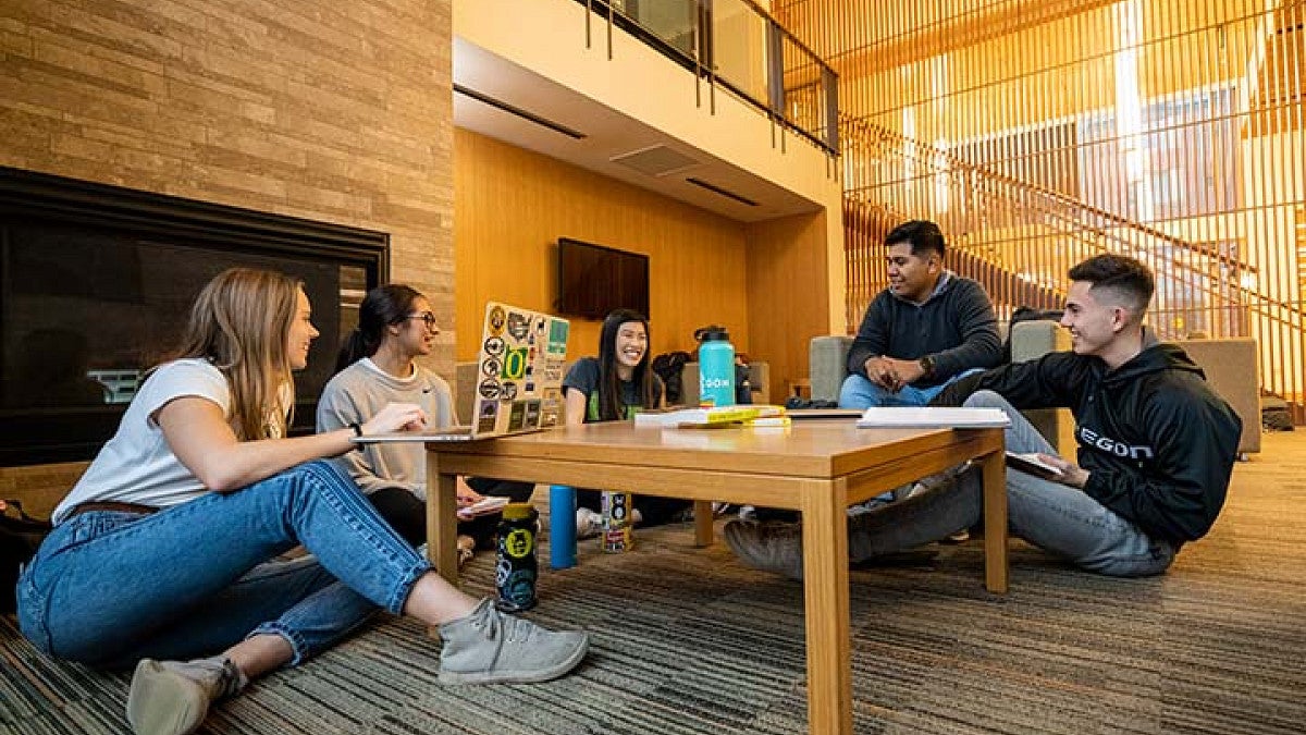 students sitting around a table talking