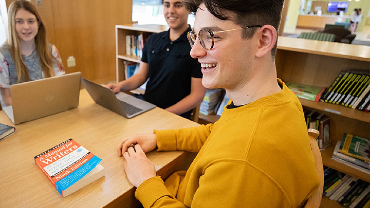 Students sitting around desk