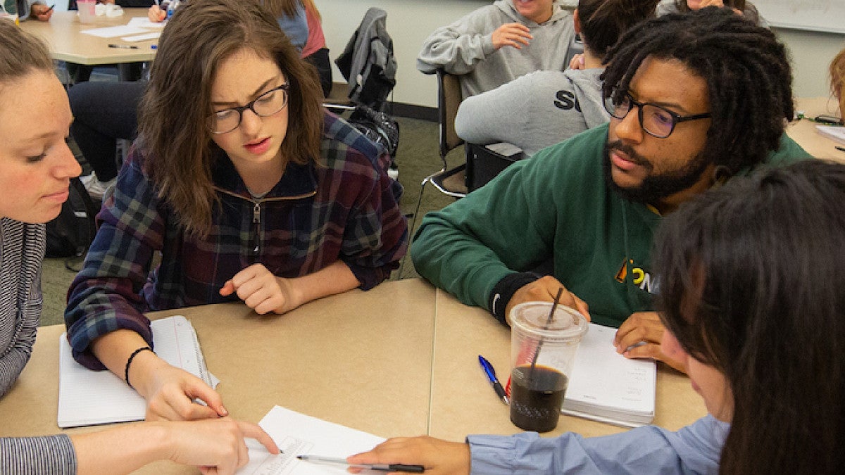 Group of students collaborating at a table