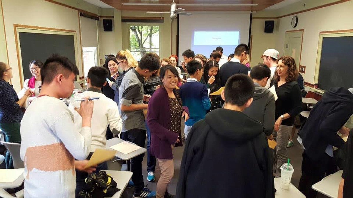 Students milling around a classroom