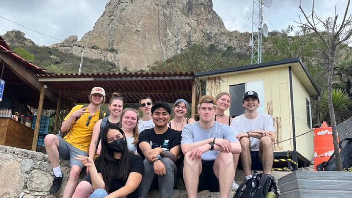 Group of students in front of mountain