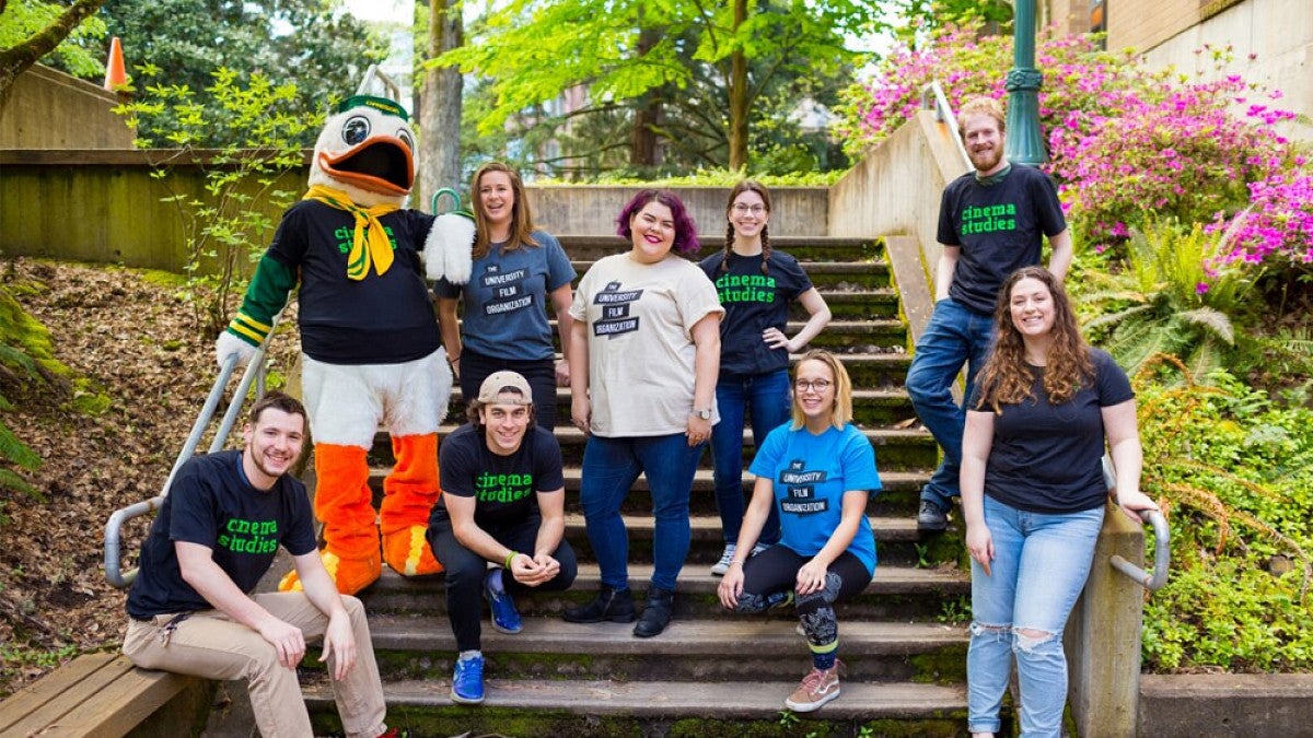 Student club posing on steps