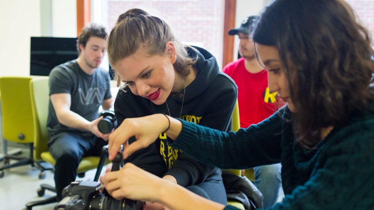 Students working with film camera