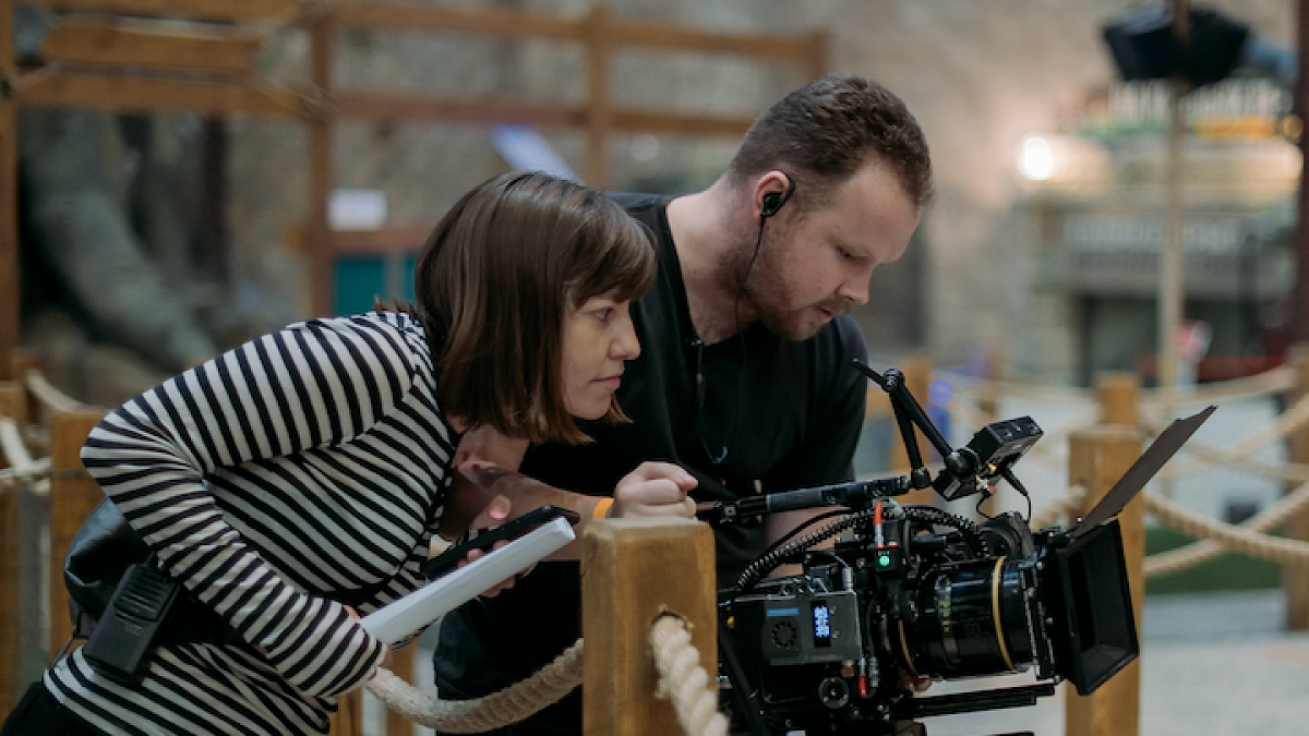 Filming and people looking at camera lens