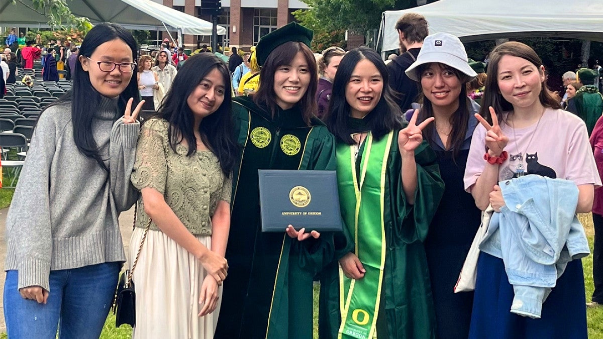 Students posing for photo at graduation