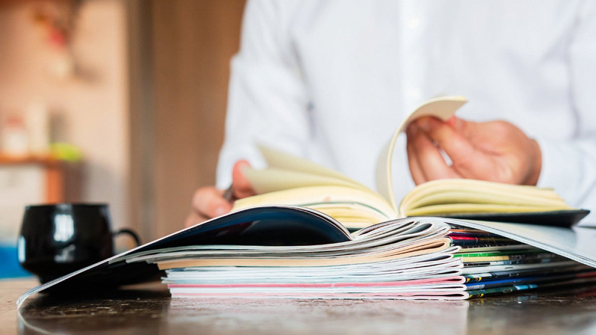 Person reading through journal