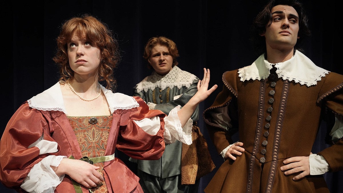 three students in character for shakespeare's much ado about nothing presented by university theatre