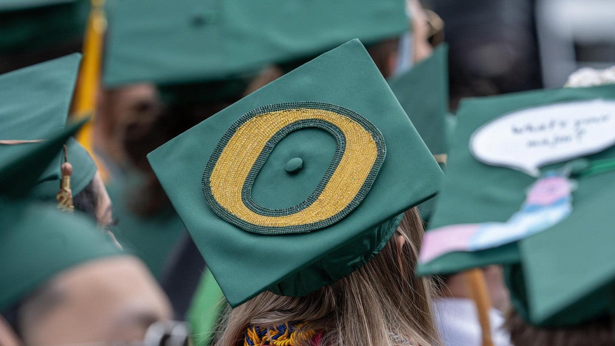 graduate cap featuring a big yellow o