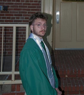 CAS student in graduation robes