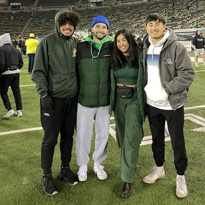 college students on field at football game