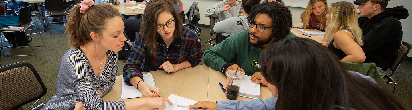 Group of students collaborating at a table