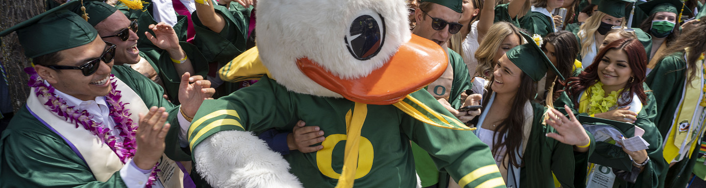 The Duck mingling with graduating students during the commencement parade