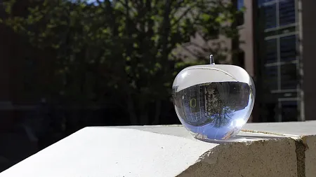 A reflection of the UO O through a glass award